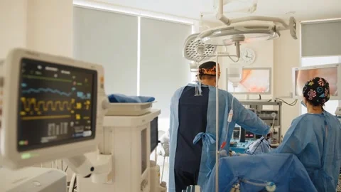 Team Performing Gynecological Surgery Using Laparoscopic Equipment Stock Footage 314303661