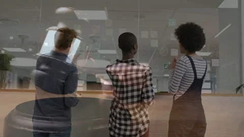 Team planning glass biz left phone pointing, leading others editing notes faint Stock Footage 333873473