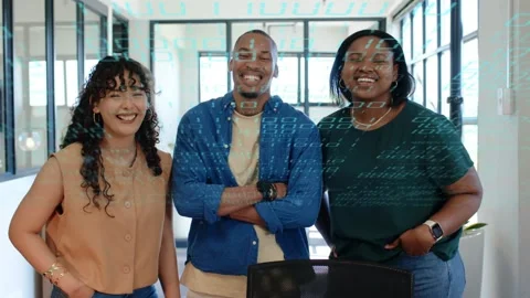 Team posing business office on camera cue, smiling while blue code overlay Stock Footage 330257555