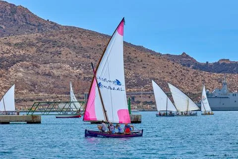 The team practices the management of a small sailing boat Stock Photos