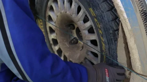 Team prepares the car for start, on Rally Stock Footage 144539348
