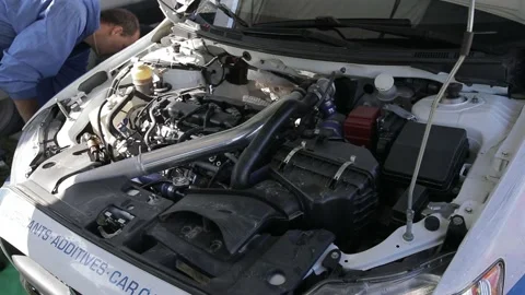 Team prepares the car for start, on Rally Stock Footage 144540573