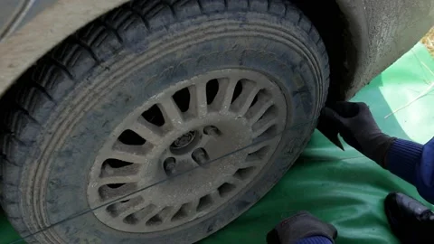 Team prepares the car for start, on Rally Stock Footage 144545872
