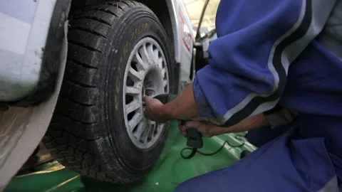 Team prepares the car for start, on Rally Stock Footage 144560032