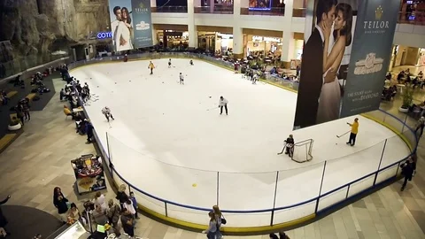 Team preparing to play hockey having hun on ice skating rink inside Afi Palace Stock Footage 75691117