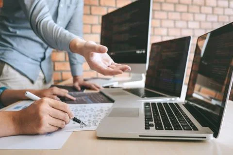 Team of Professional Developer programmer cooperation meeting and brainstormi Stock Photos