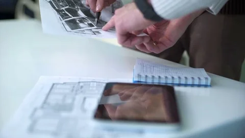 Team of professional engineers working with blueprints Stock Footage 71303416