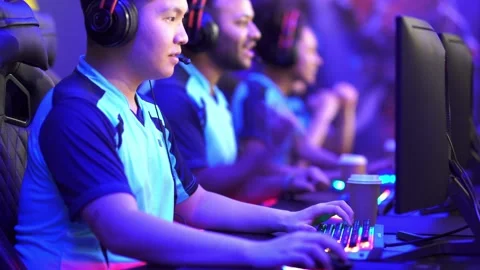 Team of professional gamers playing on pc in gaming club Stock Footage 169405033