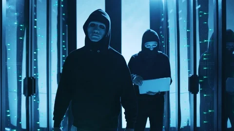 Team of professional hackers walking inside server room, breaking into Stock Footage 120695284