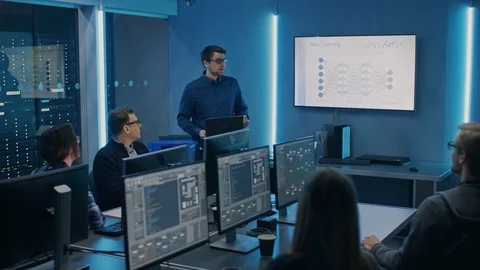 Team of Professional IT Developers Have a Meeting, Speaker Talks about New Block Stock Footage 103278110