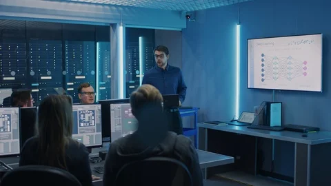 Team of Professional IT Developers Have a Meeting, Speaker Talks about New Block Stock Footage 103278475