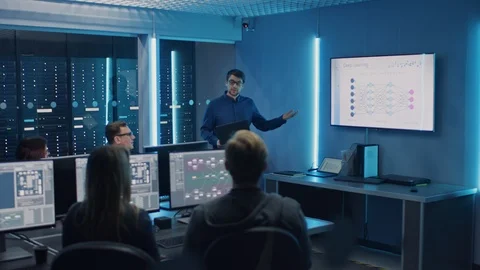 Team of Professional IT Developers Have a Meeting, Speaker Talks about New Block Stock Footage 103278577