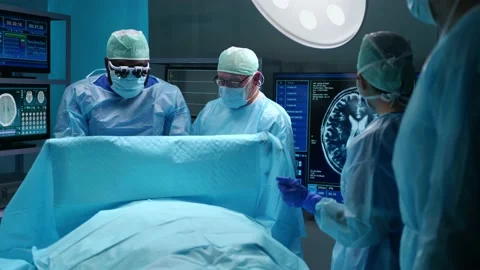 Team of professional medical surgeons performs the surgical operation in a Stock Footage 167404791