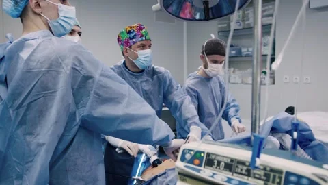 A team of professional surgeons perform an operation in a modern hospital. Video stock 270533463