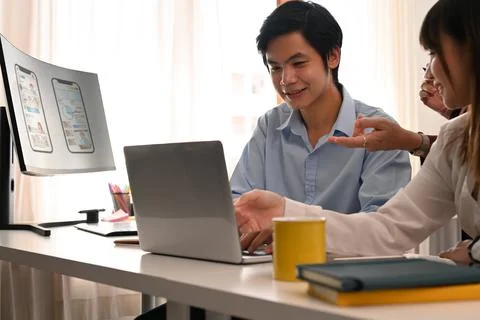 Team of professional web developer working with prototype wireframe for web Stock Photos