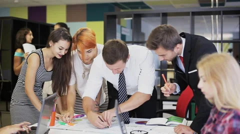 Team of professional working together, choosing, talking, correcting Stock Footage 66016597