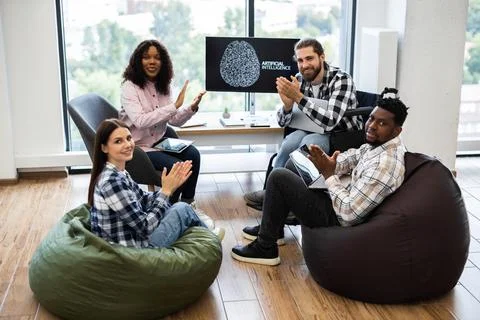 Team of professionals collaborating on artificial intelligence project 库存照片