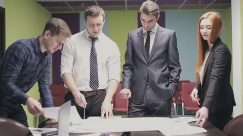 Team of professionals discusses the project, brainstorming in a business meeting Stock Footage 63336130