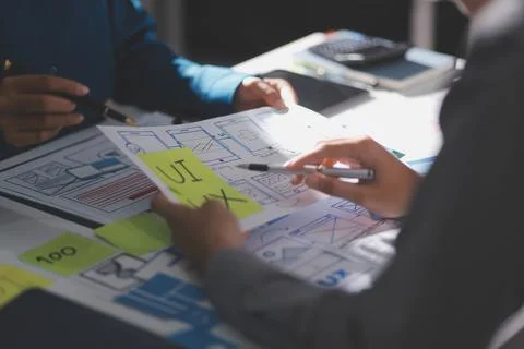Team of Program Developer Collaborating on UXUI Design Planning in a Modern.. Stock Photos