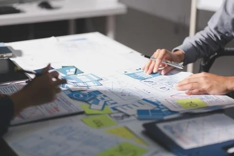 Team of Program Developer Collaborating on UXUI Design Planning in a Modern.. Stock Photos