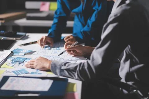 Team of Program Developer Collaborating on UXUI Design Planning in a Modern.. Stock Photos