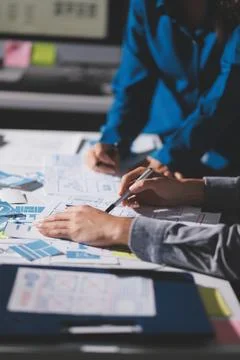 Team of Program Developer Collaborating on UXUI Design Planning in a Modern.. Stock Photos