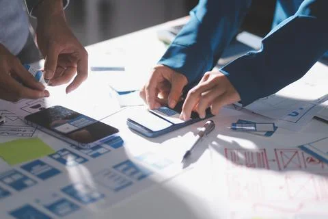 Team of Program Developer Collaborating on UXUI Design Planning in a Modern.. Stock Photos