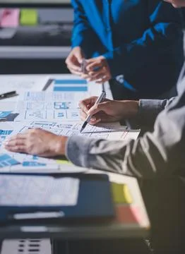 Team of Program Developer Collaborating on UXUI Design Planning in a Modern.. Stock Photos