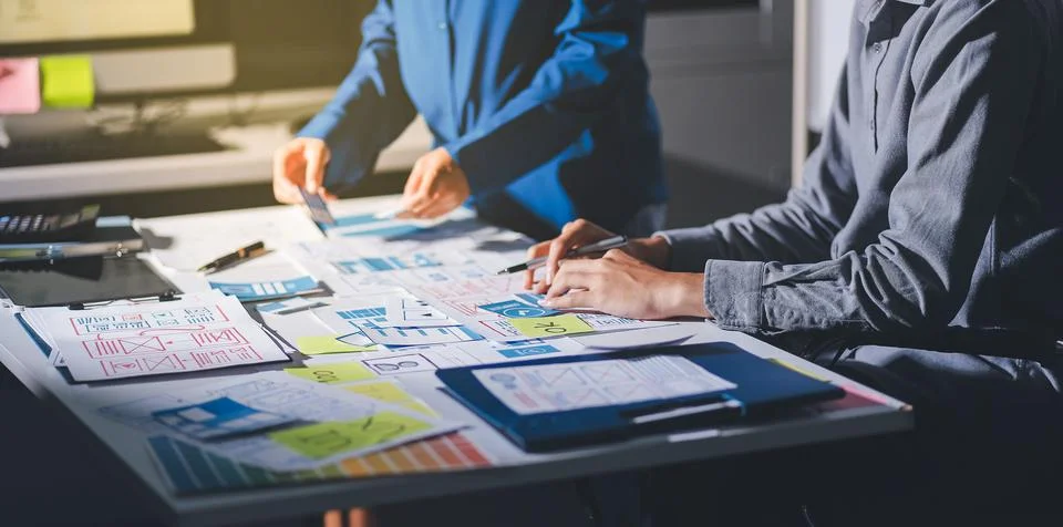Team of Program Developer Collaborating on UXUI Design Planning in a Modern.. Stock Photos
