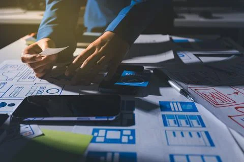 Team of Program Developer Collaborating on UXUI Design Planning in a Modern.. Stock Photos