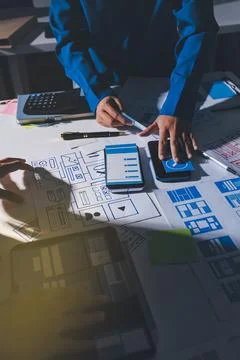 Team of Program Developer Collaborating on UXUI Design Planning in a Modern.. Stock Photos