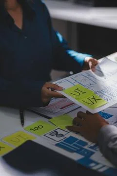 Team of Program Developer Collaborating on UXUI Design Planning in a Modern.. Stock Photos