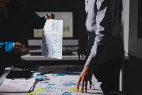 Team of Program Developer Collaborating on UXUI Design Planning in a Modern.. Stock Photos