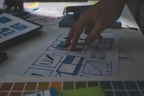 Team of Program Developer Collaborating on UXUI Design Planning in a Modern.. Stock Photos