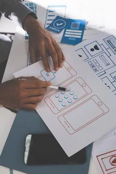 Team of Program Developer Collaborating on UXUI Design Planning in a Modern.. Stock Photos