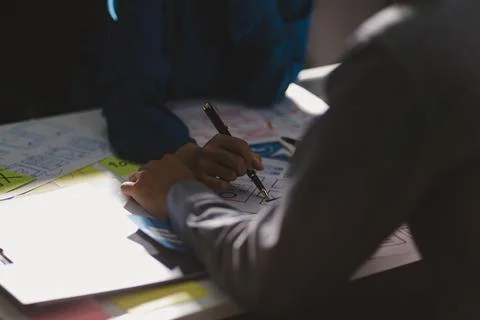 Team of Program Developer Collaborating on UXUI Design Planning in a Modern.. Stock Photos