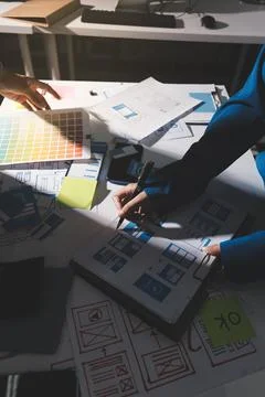 Team of Program Developer Collaborating on UXUI Design Planning in a Modern.. Stock Photos