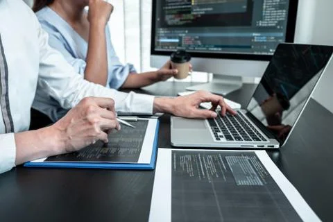 Team of Programmer working in software javascript computer in IT office, Writ Stock Photos