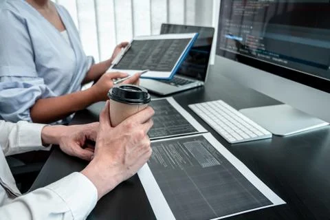 Team of Programmer working in software javascript computer in IT office, Writ Stock Photos