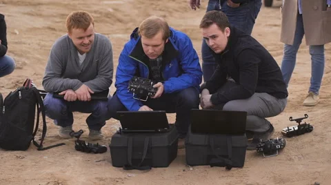 The team of programmers and technicians customizes equipment. They are engaged Stock Footage 62651901