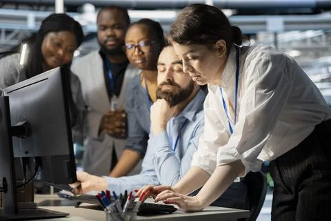 Team of programmers in data center cooperating to update storage arrays software 写真素材