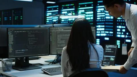 Team of programmers in data center responsible for repairs Stock Photos