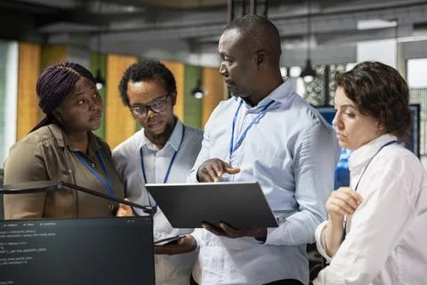Team of programmers developing software applications Stock Photos