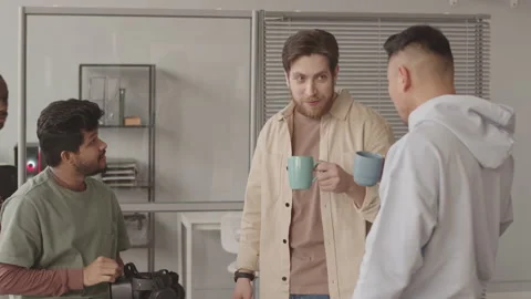 Team of Programmers Having Coffee Break in Office Stock Footage 172193011