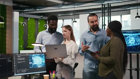 Team of programmers in office automating repetitive tasks using AI scripts Stock-Footage 313016201
