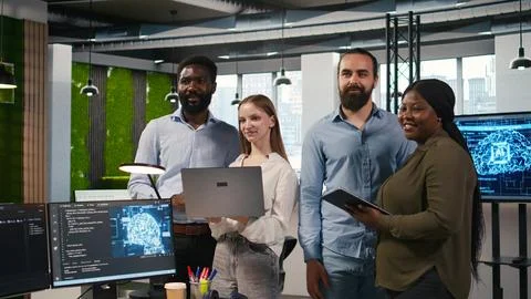 Team of programmers in office automating repetitive tasks using AI scripts 写真素材