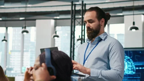 Team of programmers in office developing software applications using AI Stock Footage 313016608