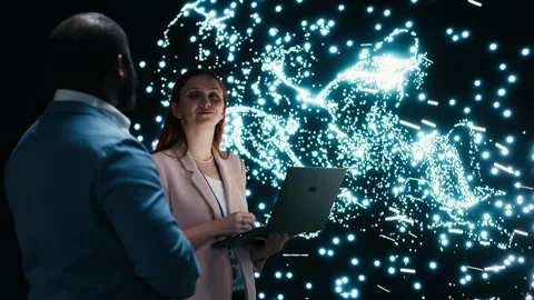 Team of programmers optimizing neural network neurons map with laptop and AR Stock Footage 330141096