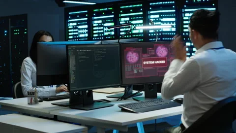 Team of programmers in server hub trying to protect hardware from hacker 스톡 동영상 280719622
