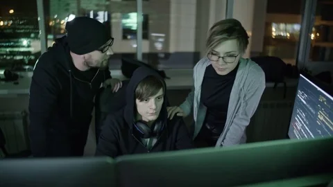 Team of Programmers Working at Night Stock Footage 76310112